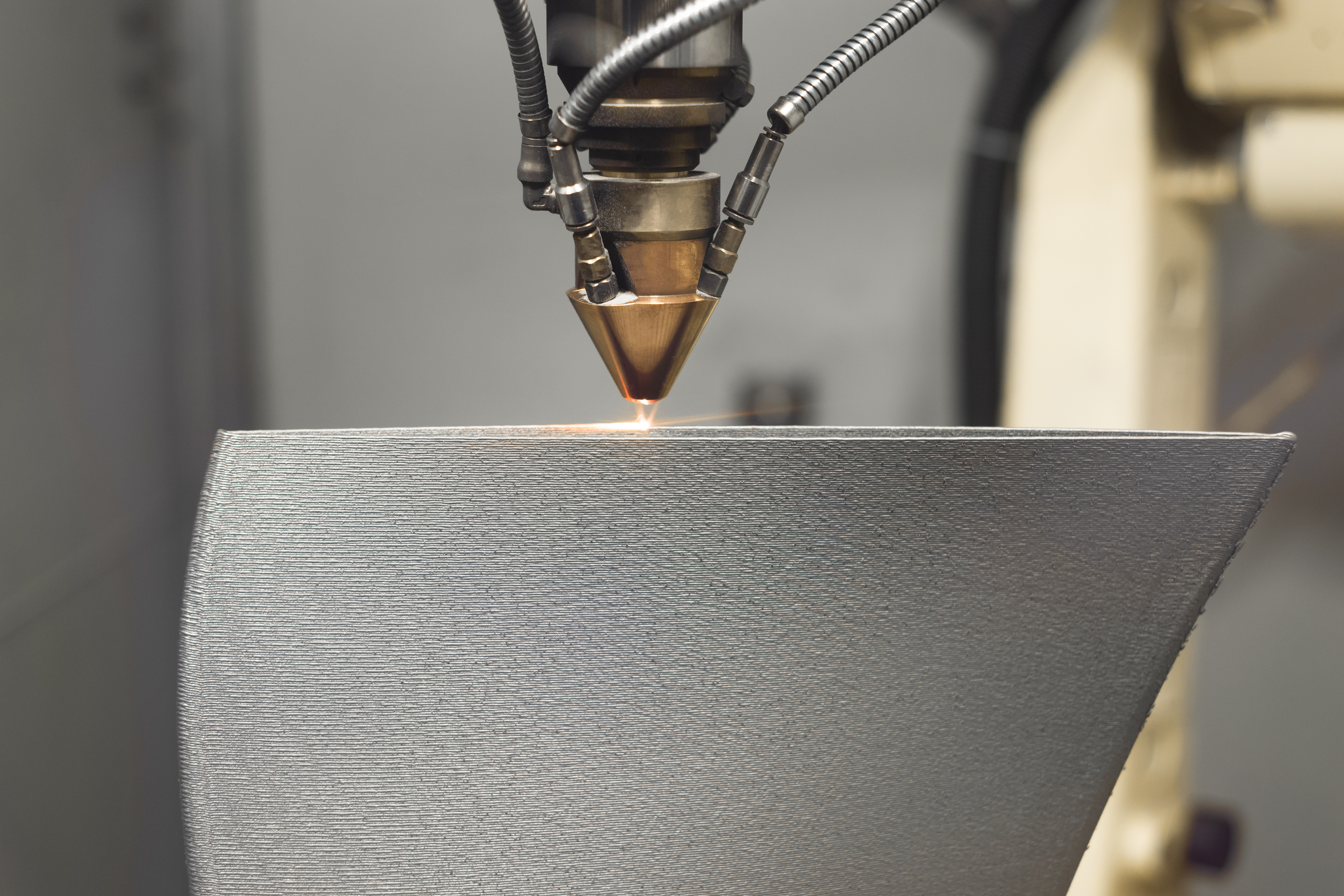 3D metal printer produces a steel part. Revolutionary additive technology for sintering metal parts. Soft focus.