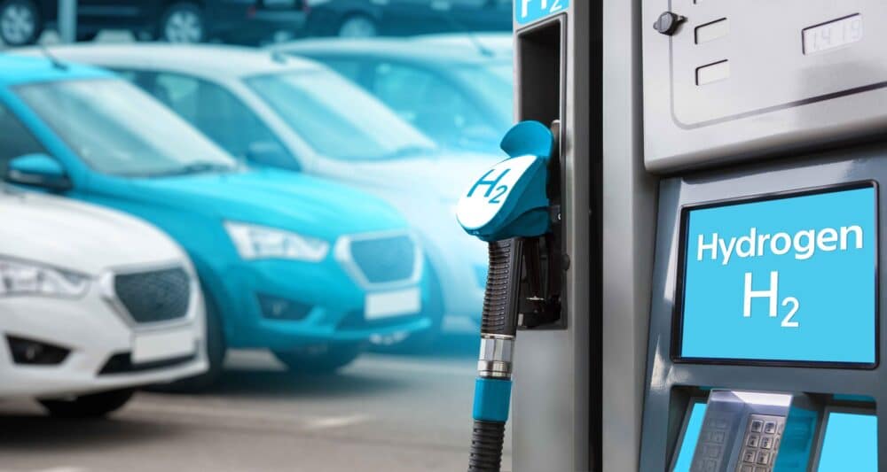 Hydrogen filling station on a background of cars. One car blue. Hydrogen filling station on a background of cars. One car blue.